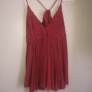 Flowy, open back tank. Adjustable in the back